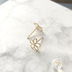 Cute dainty open work 10K SOLID yellow gold daisy flower stud earrings * Flower size: approx. 8x7.6mm * Metal: 10K Solid Gold * Post thickness: approx. 0.74mm * Post length: approx. 9mm * Each stud comes with a 10K gold silicone nut backing and 10k solid gold back will be provided with an additional cost * Stamp: 10K ❤️Visit our official website for exclusive new products.      https://elekalonjewelry.com/ ❤️Follow us on Instagram @ elekalonjewelry for the latest projects and much more! ❤️If you Everyday Gold Flower Charm Earrings, 14k Gold Flower Earrings For Gift, Dainty Gold Flower Earrings, Pierced, Dainty Everyday Flower Charm Earrings, Dainty Yellow Gold Flower Earrings For Gifts, Delicate Gold Flower Earrings For Everyday, Dainty Flower Earrings With Birth Flower For Her, Delicate 14k Gold Flower Earrings, Dainty Birth Flower Earrings As Gift For Her