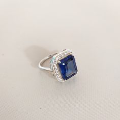 Main Stone : Lab Created Blue Sapphire Stone Color : Royal Blue Stone Size : 11x9 mm Stone Shape :Octagon Metal : 925 Sterling Silver Plating : White Gold / 14 Caret Gold / Rose Gold Side Stone : American Diamond/ CZ Setting type : Prong setting Occasion : Wedding ,Party, Anniversary, Valentine's Day,Daily Gift for : Girlfriend, Wife, Mom, Sister, Friend Style : Classic Rings Type : Halo Ring, Wedding Bands Item Type : Ring => Payment Policy We accept payment through PayPal. All payments must Blue Octagon Sapphire Ring Fine Jewelry, Blue Octagon Ring With Halo Setting, Octagon Blue Rings With Halo Setting, Blue Octagon Rings With Halo Setting, Blue Octagon Halo Setting Rings, Blue Sterling Silver Rings With Accent Stones, Octagon Blue Sapphire Ring As A Gift, Octagon Blue Sapphire Ring For Gift, Blue Octagon Sapphire Ring As A Gift