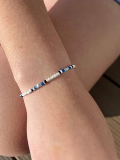 a woman's arm with a bracelet on it