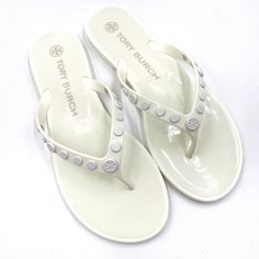 Tory Burch Studded Jelly Sandals White Flip Flop Thong Slides Sz 7 Unworn Condition Adjustable Tan Sandals For Vacation, Tan Flat Flip Flops For Vacation, Tan Cushioned Sandals For Beach, Tan Toe Post Sandals For Beach, Tan Open Toe Flip Flops For The Beach, Tan Round Toe Flip Flops For Summer, Tan Flip Flops For Summer, Tan Vacation Flip Flops, White Slip-on Flip Flops With Textured Footbed