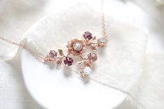 "A lovely floral rose gold bridal necklace with crystal in blush hues. - Handmade to order with Premium European Crystals - antique pink, white opal, vintage rose, light silk stones - Rose gold plated brass - Available in other finishes and crystals upon request - Necklace measures 16 inches and extends to 18 inches - Pendant measures 1.5\" x 1-1/8\" - Each piece is gift wrapped Matching earrings: https://www.etsy.com/listing/560510013/rose-gold-earrings-bridal-earrings?ref=shop_home_active_1 Br Vintage Bridal Necklace, Gold Flower Necklace, Bridal Statement Necklace, Monogram Necklace Gold, Flower Girl Necklace, Handmade Crystal Necklace, Gold Bridal Necklace, Red Beaded Necklaces, Jewelry Opal