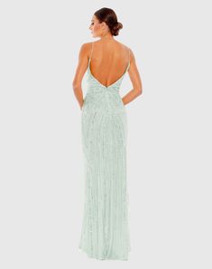 Set off fireworks in this wow-worthy gown. Made from mesh streaked with sequins and beads, this sparkling dress is designed in an ultra-flattering silhouette with a V-neckline, ruched, wrap-look bodice, peek-a-boo front slit, and beautiful open back. Add leg-lengthening platforms for an extra height boost. Mac Duggal Fully lined V-neck Sleeveless Faux wrap bodice Gathered waist Thigh-high front slit All-over alternating rows sequin and beaded embellishments Concealed back zipper Approx. 62.5" fr Sparkling Dress, Mint Pastel, Vestidos Color Coral, Neutral Dresses, Engagement Party Dresses, Spring Wedding Guest Dress, Long Formal Dress, Bride Groom Dress, Beaded Prom Dress