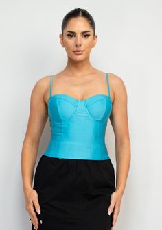 Sweetheart Corset-Like Cami Top Brand: Haute Monde Style: HMT56857 Fabric: 88% POLYESTER, 12% SPANDEX Details: A knit casual glamour top in solid color features a bustier corset-like bodice, sweetheart neckline, adjustable cami straps, and cropped length. Iris Tops Made in Cambodia. Spring Crop Top With Medium Bust Support, Spring Fitted Camisole With Medium Bust Support, Trendy Tops With Sweetheart Neckline For Night Out, Fitted Light Blue Camisole Tank Top, Fitted Cropped Top With Medium Bust Support, Trendy Fitted Light Blue Tank Top, Light Blue Fitted Cami Top, Fitted Light Blue Cami Top, Chic Tops With Medium Bust Support