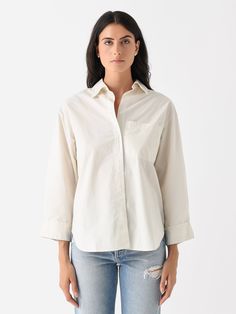 DESCRIPTION:An easy-fitting button-down shirt made from lightweight cotton with a dropped shoulder design and turnback button cuffs.FEATURES:Spread CollarDropped ShoulderLeft Chest PocketButton CuffsButton-Down PlacketCurved Hem100% CottonClassic FitModel is wearing size Small top.Model's Measurements: Height: 5'11" | Bust: 34B | Waist: 25" | Hips: 36" | Dress Size: 2-4 (US) Everyday Cotton Blouse With Roll-up Sleeves, Relaxed Fit Shirt With Shirttail Hem For Daywear, Relaxed Fit Shirt With Shirttail Hem For Day Out, White Cotton Shirt With Cuffed Sleeves, Everyday Relaxed Fit Cotton Blouse, Effortless Cotton Shirt For Daywear, Effortless Cotton Blouse With Shirttail Hem, Relaxed Fit Cotton Blouse For Everyday, Casual Cotton Blouse With Back Button Closure