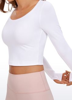 Butterluxe collection features super soft and stretchy high-quality fabric. The cropped length is just right to show the body curve perfectly. Designed with thumb holes to keep sleeves in place and warm. Ideal for yoga, workout, fitness, and exercise. Feature & Fitting: 
 Butterluxe collection 
 Design for yoga, workout 
 Big scoop neck 
 Thumbholes design 
 Fabric: 
 Extremely Soft, luxurious comfort and lightweight 
 Ultra stretchy, very gentle compression. 
 Brushed, 4-Way stretch 
 81% P Solid Activewear With Thumbholes And 4-way Stretch, Stretch Activewear With Thumbholes, Solid Compressive Activewear With Thumbholes, Long Sleeve Sports Bra With Medium Support, Fitted Soft Touch Sports Bra For Workout, Versatile Fitted Crop Top Activewear, Seamless Long Sleeve Yoga Activewear, Long Sleeve Moisture-wicking Sports Bra For Yoga, Solid Color Activewear With Thumbholes For Pilates