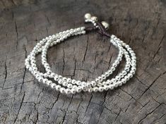 This bracelet made with 3 mm silver bead weaved together with dark brown wax cord and bell for closure with dangle. Length is approx. 7.5'' (B012) ♥..o00OoO,..Shipping..The item shipped by registered airmail within 3-5 working days after payment received. Usually takes 10-24 business days to reach destination.Feel free to contact me with any questions or requests.♥Thank you :)*~*~*~*~*~*~*~*~*~*~*~*~*~*~*~*~*~*~*~*~*~*~*~*~*~*~*~*~*~*~*~*~*~*~ Square Knot Bracelets, Bracelet Simple, Silver Chains, Brass Bracelet, Women Bracelet, Simple Bracelets, Bracelet Women, Beaded Anklets, Silver Chain Bracelet