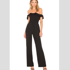 New Without Tags. Get Cocktail Party Ready With The Flirty And Sophisticated Zena Jumpsuit. A Stretch Crepe Fabric Takes An Off-The-Shoulder Neckline With A Ruffle Trim That Adds A Girlish Touch To The Tailored Pantsuit. Self: 95% Poly 5% Elastane Lining: 97% Poly 3% Elastane Hand Wash Cold Non-Slip Silicone Lined Neckline With Ruffle Trim Body Measures Approx 21" In Length 19" At The Knee Breaks To 21" At The Leg Opening. Approximate Measurements For A Size Xs: Pit To Pit 14.5 Inches, Waist 13 Fitted Strapless Jumpsuit For Spring Evening, Elegant Strapless Jumpsuit For Summer Outings, Elegant Strapless Jumpsuit For Summer Going Out, Elegant Strapless Jumpsuit For Summer, Elegant Black Strapless Jumpsuit For Spring, Elegant Strapless Jumpsuit For Going Out In Summer, Elegant Strapless Jumpsuit For Going Out, Chic Fitted Strapless Jumpsuit For Going Out, Chic Black Strapless Jumpsuit For Date Night