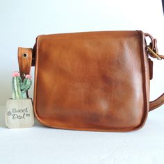 "Vtg Classic Coach Original Stewardess Bag Beautiful leather with brass hardware Roomy interior with zip pocket, front pocket, ID pocket covered by a flap and secured by a turnlock Measures: 11.5\"L, 10\"H, 4.5\"W Strap at last hole measures: 35\" with a 16\" drop Made in New York City, USA #427-2114 Flaws: slight wear/tear on piping where it folds on left side ( typical for this style) Cleaned, conditioned and ready to wear Questions? Just ask More vtg coach styles/colors also available Rc022" Classic Double Flap Bag, Classic Bag With Double Flap For Daily Use, Classic Double Flap Bag For Daily Use, Vintage Double Flap Shoulder Bag For Formal Occasions, Classic Double Flap Shoulder Bag For Daily Use, Brown Satchel With Turn-lock Closure For Daily Use, Vintage Shoulder Flap Bag, Classic Flap Bag For Daily Use, Daily Use Flap Bag With Turn-lock Closure