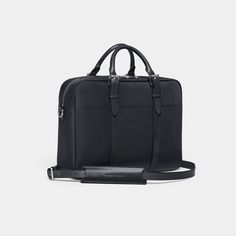 The award-winning original waterproof and lightweight men's briefcase with umbrella holder | Stuart & Lau - The Cary Briefcase - Single Compartment - Black. Modern Business Briefcase With Palladium Hardware, Classic Satchel Cases For Everyday Use, Classic Everyday Satchel Case, Classic Everyday Satchel Cases, Modern Briefcase With Palladium Hardware For Everyday, Modern Briefcase With Palladium Hardware, Classic Briefcase With Luggage Sleeve For Everyday Use, Classic Rectangular Laptop Bag For Everyday Use, Timeless Briefcase With Luggage Sleeve For Everyday Use