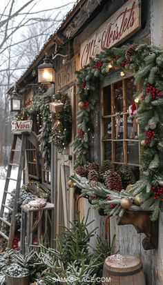 christmas wreaths are hanging on the side of a building