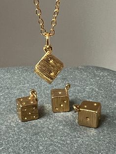 This little lucky dice is  a recycled brass dice made in the uk  The perfect gift , this little dice measure 0.8cm X0;8 cm, a sweet pendant  This charm is sold alone , or with  a simple chain 60cm British made. Tiny Gold Charms For Gifts, Tiny Gold Charms As Gifts, Dice Keychain, Dice Jewelry, Simple Chain, Girls Frontline, Gold Gift, Brass Charms, Gold Pendant