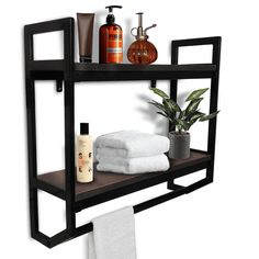 a shelf that has towels, soaps and other items on it