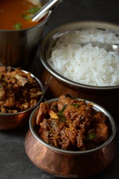 three metal bowls filled with food next to white rice