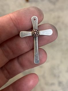 "This unique cross pendant is handcrafted in .925 Sterling silver & features your choice of a copper accent as shown or a bronze accent (gold color / not shown). I oxidize the metal slightly so that it looks a bit rustic & aged.  Each cross is made to order & will have slight variations but will closely resemble the example in the photos.   These necklaces make the perfect gift for anytime or anyone of the faith, but they're most popular as gifts for weddings, baptisms, confirmations, missionari Copper Cross Jewelry For Gifts, Nickel-free Sterling Silver Cross Pendant, Nickel-free Sterling Silver Cross Charm, Artisan Cross Necklace For Gift, Artisan Cross Jewelry For Jewelry Making, Hand Forged Crucifix Jewelry Gift, Artisan Sterling Silver Crucifix Jewelry, Rose Gold Sterling Silver Cross Necklace, Artisan Hand Forged Cross Jewelry