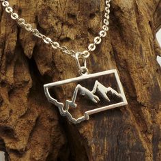 "Montana Mountain necklace was made and inspired by montana wildlife. Base Material: Sterling Silver Crafting Time: 7 - 10 working days Size: 23mm X 12mm (Approximately Plus Hoop. Please refer to the picture above) Metal Stamped: 925 Thickness: 1mm (Approximately.) If you need the item urgently, please contact us for Express Mail. There are extra cost for Express service. You'll receive Order Shipped Email from us when your item is completed and shipped. SPECIAL ANNOUNCEMENT 1. Please visit http Personalized Adjustable Nature-inspired Jewelry, Adjustable Nature-inspired Jewelry For Outdoor, Rustic Sterling Silver Jewelry, Adjustable Nature-inspired Outdoor Jewelry, Handmade Rustic Jewelry For Outdoor, Rustic Sterling Silver Engraved Jewelry, Rustic Engraved Sterling Silver Jewelry, Silver Rustic Jewelry Gift, Rustic Silver Jewelry Gift