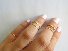 Gold knuckle rings Adjustable Gold Stackable Rings With Simple Design, Adjustable Simple Gold Stackable Rings, Gold Stackable Rings With Open Band Design, Gold Stackable Rings With Simple Open Band Design, Gold Stackable Midi Rings With Open Band, Gold Stackable Open Band Midi Rings, Dainty Gold Stackable Rings With Open Band, Gold Midi Rings With Simple Design For Wedding, Simple Gold Midi Rings For Wedding