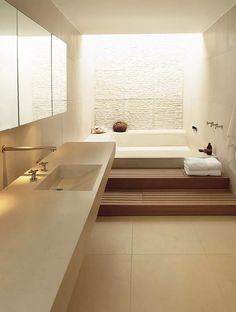 a bathroom with two sinks and a bathtub