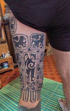 a man with a tattoo on his leg