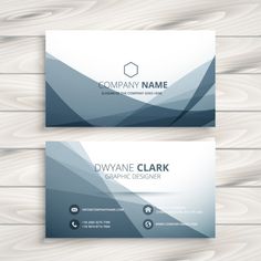 two business cards on wooden background with white and blue shapes, mock up for printing