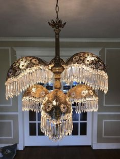 a chandelier hanging from the ceiling in a room