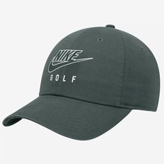 the nike golf hat is shown in dark green with white and black lettering on it