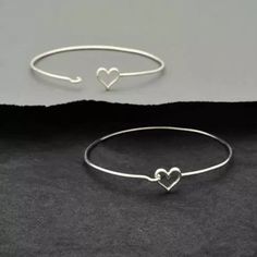 Sterling Silver or bronze Heart Hook and Eye Bracelet. Made of recycled silver. 925 sterling silver made from 1.4 mm diameter wire, which we estimate to be between 14 and 16 gauge. Inside diameter of this bracelet is about 2 1/3 inches and circumference is 7 inches. Silver Heart Bangle Bracelet For Friendship, Silver Dainty Heart Bangle Bracelet, Handmade Heart-shaped Sterling Silver Bracelets, Handmade Heart-shaped Sterling Silver Bracelet, Handmade Minimalist Heart Bracelet For Valentine's Day, Handmade Sterling Silver Heart Bracelet For Valentine's Day, Handmade Silver Heart Bracelet For Mother's Day, Bronze Bangle, Sweetheart Jewelry