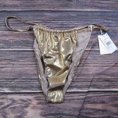 Trendy Fashion Good American NEW 2XL Size 5 Gold Foil Ruched Vacay Bikini Bottom Sparkle, Women's Swimwear Gold Stretch Swimwear For Beach Season, Gold Tie-side Bottoms For Summer, Stretch Gold Bottoms For Beach, Summer Ruched Swimwear Briefs, Summer Ruched Brief Swimwear, Ruched Brief Swimwear For Summer, Gold Beachwear Bottoms For Summer, Gold Bottoms For Summer Pool, Gold Bottoms For Summer Pool Activities