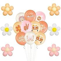 a bunch of balloons and flowers on a white background