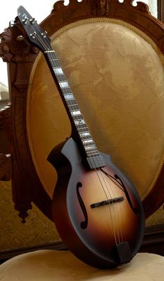 a mandolin sitting on top of a chair