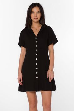 A must-have for any fashion-forward woman, the Sirina Dress is a versatile addition to your wardrobe. This button-up dress features a v-neck, short sleeves, and a lapel collar, elevating the classic design. Look stylish in this timeless piece. Material: 100% Linen Machine wash cold or hand-wash Color: Black Model is 5'9" and wearing a size XS Imported Button Up Dress, Black Model, Look Stylish, New Tops, Lapel Collar, Xl Dress, Dresses Xs, Outerwear Jackets, Jacket Outfits