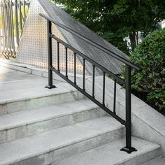 an iron hand rail is on the stairs