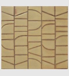 a close up view of a tile wall with wavy lines and curves in beige tones