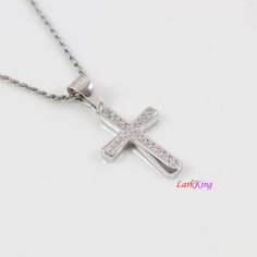 "Sterling silver cross necklace, small cross necklace, unique thick cross pendant, religious necklace, gift for Christian, gift for Baptism, christian jewelry, first communion gift. Cross pendant: Solid 925 sterling silver with cubic zirconia crystal, white gold plating Pendant size: 1/2\"x 3/4\" Pendant weight: 1.4 g Chain: white gold plating solid 925 sterling silver; high quality unique chains; see images above. To select Sterling Silver Chain Style and Length from a drop down menu: Figaro ch White Gold Cross Pendant For First Communion, White Gold Cross Pendant Necklace For First Communion, White Cross Necklace For First Communion, White Cross Necklace For Baptism, Silver Cross Pendant Jewelry For Baptism, Silver Crucifix Necklace For Baptism, White Cross Pendant Necklace For Baptism, Sterling Silver Cross Pendant Necklace For First Communion, Sterling Silver Cross Necklace For First Communion