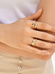 Mix up your ring stack with a fun new twist. The Bridget Ring is a stunning teardrop wrap ring brings depth and effortless cool to your everyday jewelry collection. Wear it solo for a standout statement or stack it with others for a look that turns heads. Minimalist Teardrop Stackable Jewelry, Teardrop Stackable Adjustable Rings, Minimalist Teardrop Ring For Everyday, Adjustable Bypass Ring With Modern Twist, Modern Twist Adjustable Bypass Ring, Fine Jewelry Stackable Teardrop Ring, Fine Jewelry Teardrop Stackable Rings, Midi Rings With Open Band And Modern Twist, Modern Twist Midi Rings With Open Band