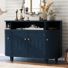 a blue cabinet with drawers and mirrors on the wall