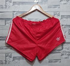 Welcome to our store.  Antique Adidas shorts Size: 6/ L/XL/ Vintage Small Logo Adidas/ Authentic 80s 90s sport striped pattern track style activewear stripes Short Please make sure of the measurements and do not be satisfied with the written sizes because they differ from country to country. Tagged Size: 6/ L/ XL Belt: 40-50 cm/ 15-19 Length: 27 cm/ 10.6 inch Condition:          8/10 Perfect condition. This item is used but in good condition. If there are any nuances - they will be listed in the Sportswear Shorts With Three Stripes For Summer, Summer Sportswear Shorts With Three Stripes, Summer Sportswear Shorts With Side Stripes, Sporty Striped Shorts For Sports, Summer Streetwear Shorts With Three Stripes Branding, Summer Athletic Shorts With Three Stripes Branding, Casual Striped Sports Shorts, Casual Athletic Shorts With Side Stripes For Summer, Casual Summer Athletic Shorts With Side Stripes