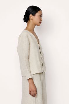 Introducing our Tie Front Blouse, a sophisticated sustainable staple for any wardrobe Crafted from organic linen, this shirt exudes effortless style. Pair it effortlessly with our Everyday Pant for a laid-back look. Made with organic Linen Lined with organic cotton Handmade in India Machine wash cold, lay flat to dry, warm iron as needed. Honoring Earth + Maker Our wovens are handcrafted in India, preserving age-old textile traditions. Made in beautiful, family-operated studios under safe workin Spring Flax Relaxed Fit Blouse, Effortless Linen Tops For Day Out, Versatile Linen Blouse For Work, Relaxed Linen Blouse For Day Out, Relaxed Linen Blouse For Work, Spring Flax Color Tops For Daywear, Spring Linen Loungewear Blouse, Spring Linen Blouse In Flax Color, Flax Blouse For Spring Workwear