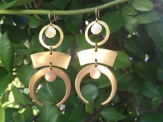 "These beautiful brass STATEMENT earrings were created with a mixture of brass geometric shapes and brass charms. These lightweight earrings hang beautifully from 24k gold plated ear wires and measure 2 1/2 inches in length and 1 inch wide at widest point. These earrings make the \"perfect gift\" for your mom, sister, daughter, friend, girlfriend, wife or bridesmaids....She will truly love these and treasure them for many years to come. ~All of my listings are handmade with love and ready to shi Bohemian Metal Linear Earrings For Pierced Ears, Bohemian Brass Linear Earrings For Pierced Ears, Bohemian Metal Linear Earrings, Bohemian Geometric Earrings With Ear Wire, Modern Gold Earrings, Friend Girlfriend, Earrings Geometric, Brass Charms, Lightweight Earrings