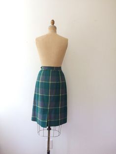 vintage 50s wool skirt Green, pink and yellow stripe plaid straight to a-line cut Side metal zipper and hook & eye closure Back walking pleat Softly pleated in the front Excellent vintage condition Approx size Small Measures waist- 25 inches hips- 40 inches length- 25 inches Era 50s Vintage Wool Lined Skirt, 1940s Plaid Skirt, Vintage Wool Skirt, 1950s Plaid Skirt, Retro Knee-length Plaid Skirt, Retro Plaid Cotton Skirt, Skirt Winter, Winter Skirt, Wool Skirt