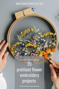 someone is working on a flower embroidery project with the words 20 prettiest flower embroidery projects