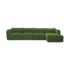 a green sectional couch with pillows on the top and bottom, in front of a white background