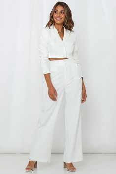 Length from shoulder to hem of size S: 38cm. White cropped blazer. Lined.  Cold hand wash only. Model is a standard XS and is wearing XS. True to size. Non-stretchy woven fabric. Button-through front. Internal shoulder padding.  Polyester/Elastane. MOSSMAN's The Last Goodbye Blazer is a modernised version of a beloved business staple. Made for all Boss ladies and confident women, this cropped style showcases a sleek structured fit in a pristine white finish, with a single-breasted button front. Take your look to the next level and style it with the brand's matching pants. White Cropped Blazer, The Last Goodbye, Last Goodbye, Boss Ladies, Confident Women, Blazer White, Power Suit, Leg Cuffs, Cropped Blazer