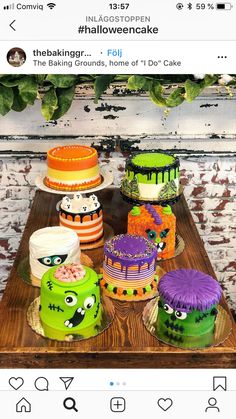 a table topped with lots of cakes covered in frosting