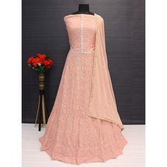 Peach colored suit is prettified with floral embroidery work as shown which makes it appear classy. This top is made of georgette fabric which is accompanied with santoon bottom & inner and georgette dupatta. Women can buy this suit to wear for their festive, party and events. Note:- The actual product may differ slightly in color and design from the one illustrated in the images when compared with computer or mobile screen. Size Chart Size: Semi Stitched/Unstitched can be altered from maximum to minimum size based on size chart Fitted Peach Sets With Intricate Embroidery, Unstitched Georgette Gown With Floral Embroidery, Fitted Anarkali Set With Intricate Embroidery In Georgette, Peach Semi-stitched Georgette Lehenga, Fitted Peach Anarkali Set, Formal Pink Sharara, Pink Georgette Unstitched Suit For Reception, Fitted Pink Anarkali Set With Intricate Embroidery, Pink Anarkali Unstitched Suit For Reception