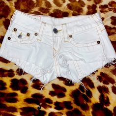 Super Cute White True Religion Shorts These Shorts Are Vintage And Nwot Shorts Are All White Aside From The Brown Stitching Around Them Which Compliments The Shorts Amazingly. Shorts Have A Mini Pockets In Front With An Even Smaller Pocket On The Left Side Back Has Larger Closing Pockets Shorts Are 100% Cotton And Do Not Stretch I Would Recommend Going Up A Size With Tr Shorts So Be Careful When Ordering. Trendy White Short Pants, White Fitted Mid-rise Shorts, White Mid-rise Shorts With Pockets, True Religion Shorts, Be Careful, All White, Shorts With Pockets, True Religion, White Shorts