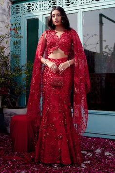 Red attached cancan structured mermaid lehenga features intricate cutdana, dori, red sequins, beads, and floral applique work embroidery. Comes with matching padded blouse with floral applique detailing highlighted with nalki crystals and beads and a heavily embroidered dupatta with botanical motifs. - Aza Fashions Red Semi-stitched Lehenga For Evening, Traditional Red Lehenga For Evening, Red Fitted Lehenga For Party Wear, Red Party Wear Sets For Reception, Elegant Red Lehenga With Unstitched Blouse, Red Floor-length Sharara With Unstitched Blouse, Red Party Wear Choli For Wedding, Red Evening Sets With Unstitched Blouse, Red Lehenga For Diwali Evening