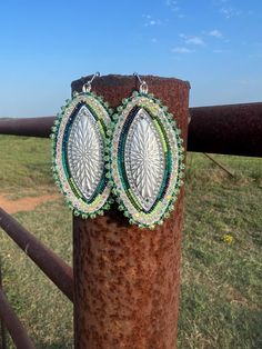 Beautiful beaded earrings. Teal, green and white colors. They are made with size 13 beads and backed with deerskin leather. They are large but lightweight. Southwestern Green Earrings With Colorful Beads, Southwestern Style Green Earrings With Colorful Beads, Handmade Southwestern Green Beaded Earrings, Handmade Southwestern Green Earrings, Southwestern Green Beaded Dangling Earrings, Southwestern Green Beaded Dangle Earrings, Green Large Beaded Earrings For Festival, Southwestern Green Earrings With Dangling Beads, Artisan Green Beaded Earrings Nickel Free