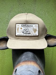 Men's Sendero Diamond Back Cap West Texas Desert Scene Patch Spirit of the West Soul of the Wild 6 Panel Cap Tan Body/ Off White Patch Beige Flat Bill Trucker Hat For Outdoor, Beige Snapback Hat With Flat Bill For Outdoor, Beige Snapback Cap For Outdoor, Beige Snapback Trucker Hat, Flat Bill Snapback Hat For Camping, Casual Baseball Cap With Curved Bill For Rodeo, Beige Trucker Hat With Curved Bill For Outdoor, Beige Curved Bill Trucker Hat For Outdoor, Casual Rodeo Hat With Curved Bill