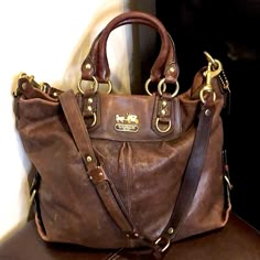 Coach Vintage Large Brown Leather Top Handle Crossbody External Zipper Bag Vintage Coach Bag Coach Brown Leather Convertible Top Handle Crossbody Tote Shoulder Bag Colors: Brown Leather, Pink Lining, Gold Hardware Crossbody Strap With Leather Shoulder Pad Reinforced With Gold Grommets, Large Jump Rings And More Grommets As It The Leather Attaches To Oversized Metal Clasps Gold Buckles At Bottom Corners Of The Bag External Full Zipper Pocket Internal Full Zipper Pocket Pink Satin Lining Gold Auth Brown Leather Top, Vintage Coach Bag, Horse And Carriage, Gold Horse, Vintage Coach Bags, Convertible Top, Brown Leather Bag, Brown Purses, Bags Coach