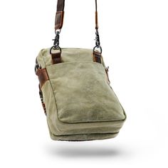 * Durable canvas and leather construction
 * Plenty of compartments
 * Adjustable-length strap Daily Use Camera Shoulder Bag With Zipper Pocket, Casual Crossbody Camera Bag With Zipper Closure, Daily Use Camera Shoulder Bag With Zipper, Outdoor Pouch Bags With Zipper Closure, Casual Everyday Carry Rectangular Bag, Casual Rectangular Everyday Carry Bags, Outdoor Brown Shoulder Bag With Zipper Closure, Brown Outdoor Shoulder Bag With Zipper Closure, Outdoor Rectangular Shoulder Bag With Zipper Closure